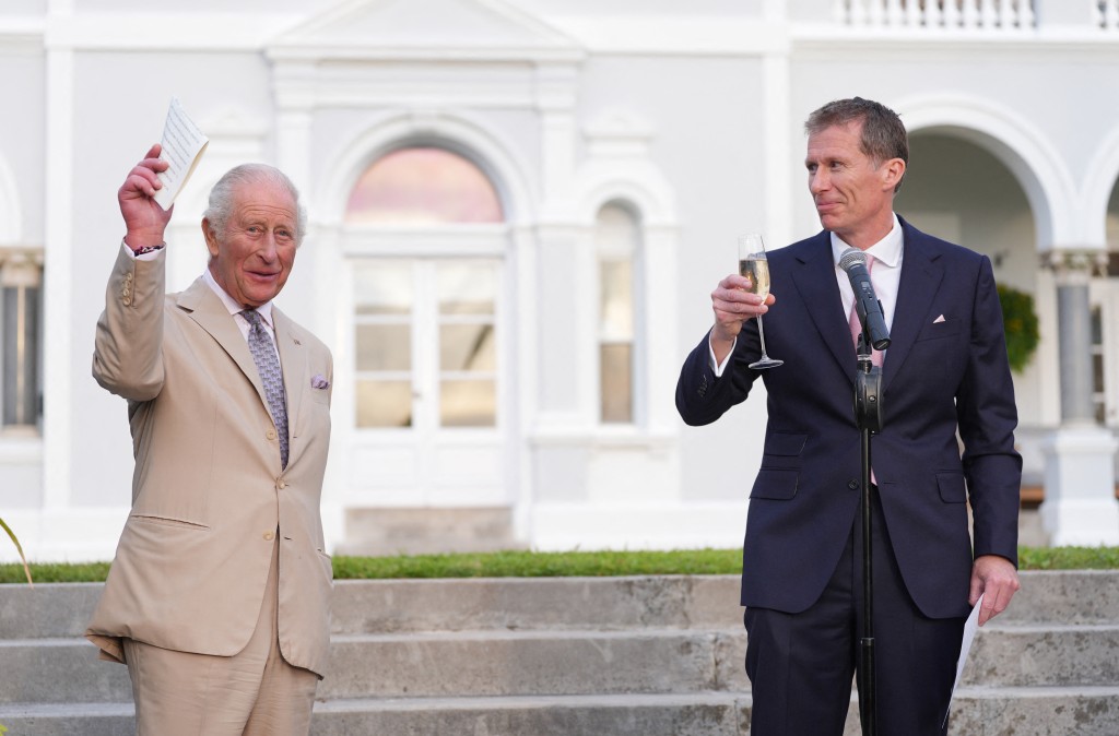 Photo by YUI MOK / POOL / AFP. The Governor of Bermuda Andrew Murdoch offers a toast for Britain's King Charles III during a garden party at the Government House in Hamilton, Bermuda, on May 1, 2026.