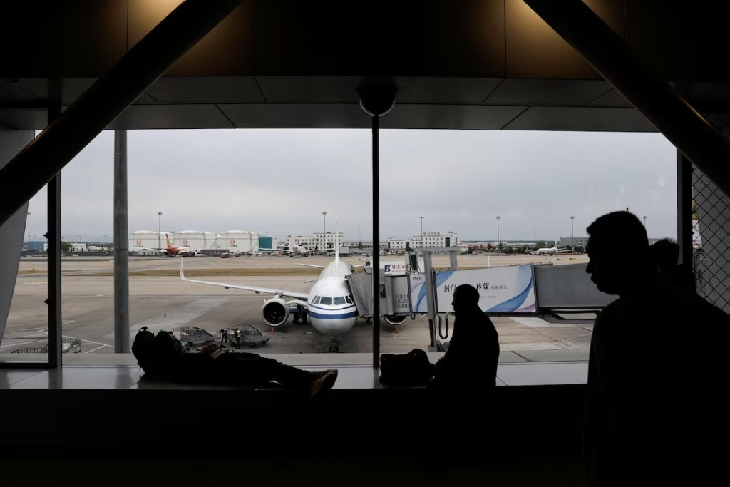 Passengers wait for their flights at the Beijing Capital International Airport. Reuters  