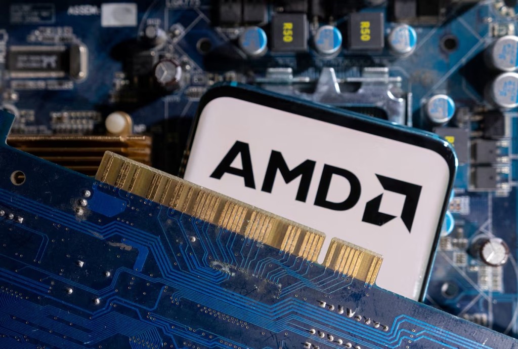 A smartphone with a displayed AMD logo is placed on a computer motherboard in this illustration taken March 6, 2023. REUTERS
