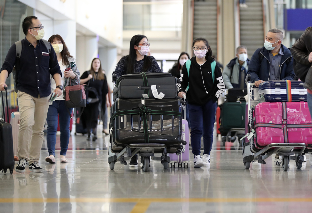Passengers arrive at the Hong Kong International Airport. New policies on those leaving through the BNO visa route may be looming, says Lau Siu-kai.BLOOMBERG, REUTERS Passengers arrive at the Hong Kong International Airport. New policies on those leaving through the BNO visa route may be looming, says Lau Siu-kai.BLOOMBERG, REUTERS