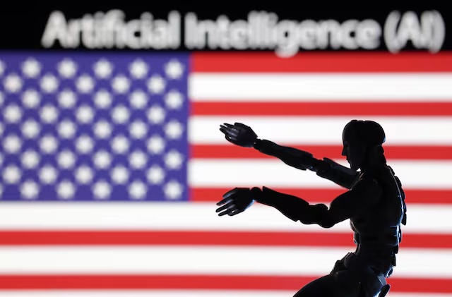 AI Artificial intelligence words, miniature of robot and U.S. flag are seen in this illustration taken December 21, 2023. REUTERS/Dado Ruvic/Illustration