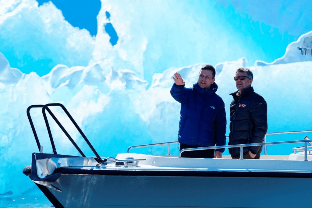 Denmark’s King Frederik (right) and Greenland’s head of government Jens-Frederik Nielsen are pictured in front of an iceberg during a boat trip in Nuuk fjord, in Greenland, on Tuesday. Reuters