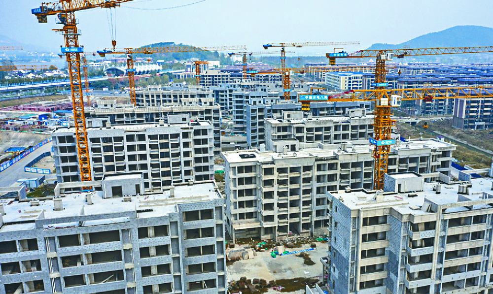 Unfinished residential buildings at Evergrande’s Health Valley development on the outskirts of Nanjing. BLOOMBERG Unfinished residential buildings at Evergrande’s Health Valley development on the outskirts of Nanjing. BLOOMBERG