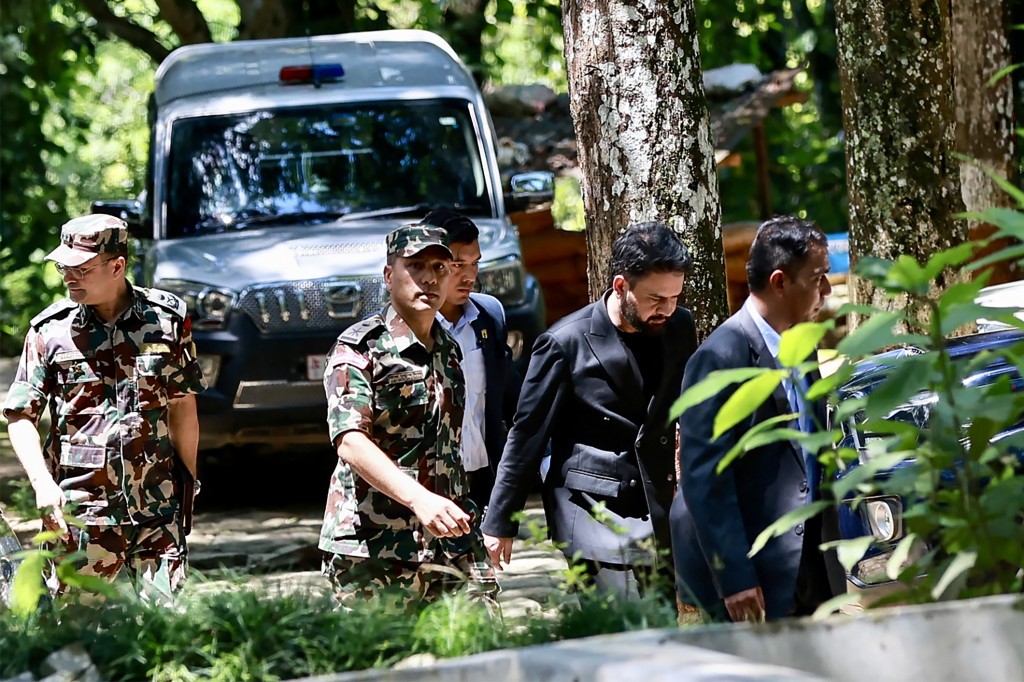 Photo by PRABIN RANABHAT / AFP  Nepal's Prime Minister Balendra Shah (2R) arrives to inspect the area following flash floods at Bidur Municipality in Nepal's Nuwakot district on August 27, 2026.