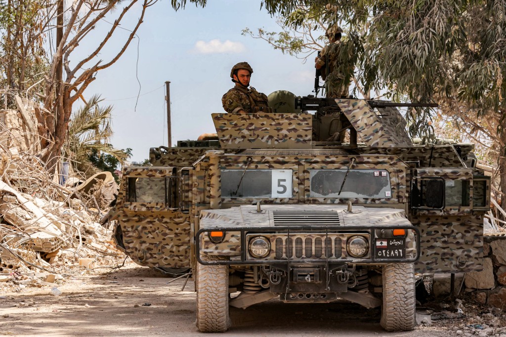 Lebanese army soldiers sit in a humvee while on patrol in the village of Zawtar al-Gharbiyeh in southern Lebanon on July 26, 2026. (AFP)