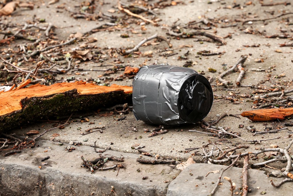 View of an unexploded homemade explosive device thrown by a left-wing activist towards police during a protest organized by far-right influencer Jake Lang against alleged "Islamification" and to ask for a "stop of public Muslim prayer" in New York, in front of Gracie Mansion, New York mayor Zohran Mamdani's official residence, in New York on March 7, 2026. (AFP)