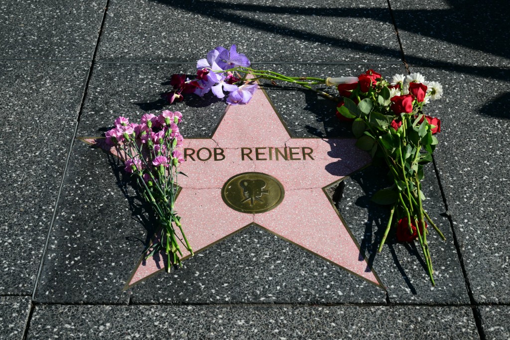 Photo by FREDERIC J. BROWN / AFP. Flowers are left at US actor and director Rob Reiner's Star on the Hollywood Walk of Fame in Los Angeles, California, on December 15, 2025.