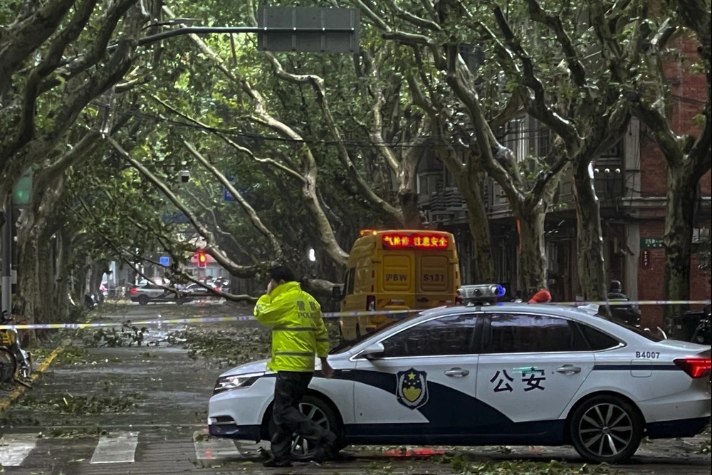 Fallen tree branches seen on the streets amid heavy rainfall, after Typhoon Bebinca made landfall in Shanghai. (AP)