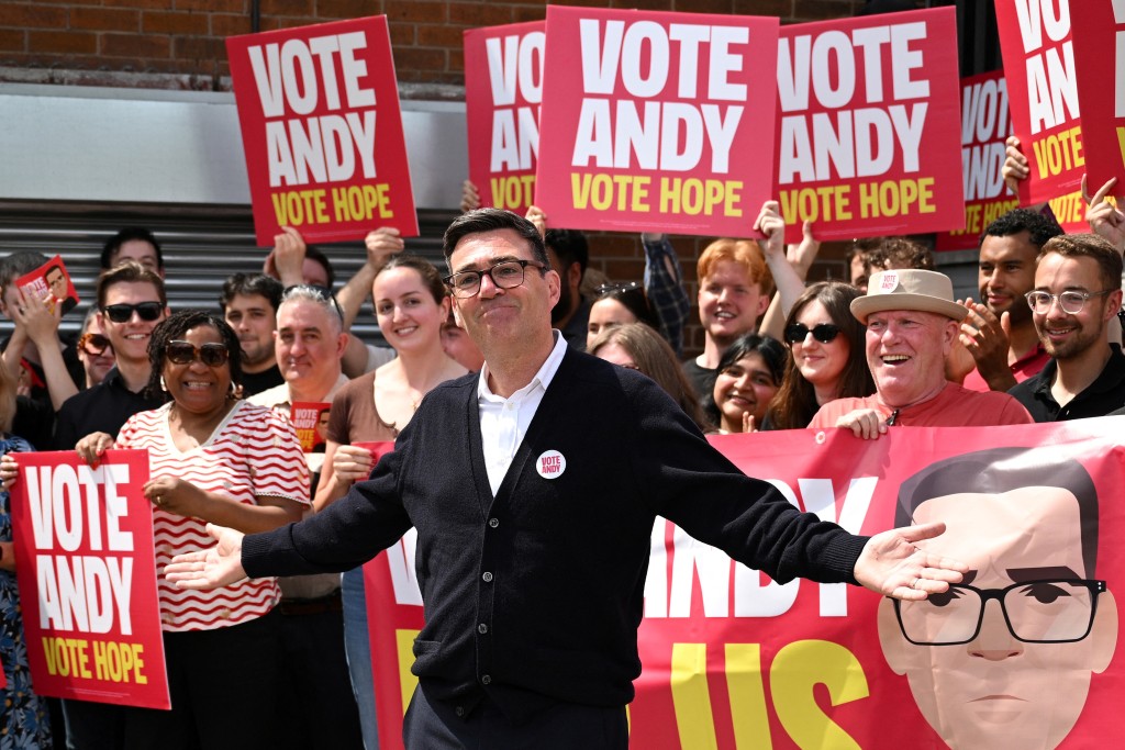 Photo by OLI SCARFF / AFP Labour party candidate Andy Burnham addresses supporters outside the Labour party campaign office in Ashton in Makerfield, northwest England, on June 18, 2026, as voters go to the polls to vote in the Makerfield by-election.