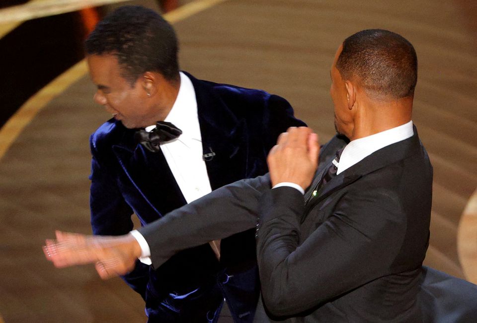 Will Smith (R) hits Chris Rock as Rock spoke on stage during the 94th Academy Awards in Hollywood, Los Angeles, California, U.S. (Reuters) Will Smith (R) hits Chris Rock as Rock spoke on stage during the 94th Academy Awards in Hollywood, Los Angeles, California, U.S. (Reuters)