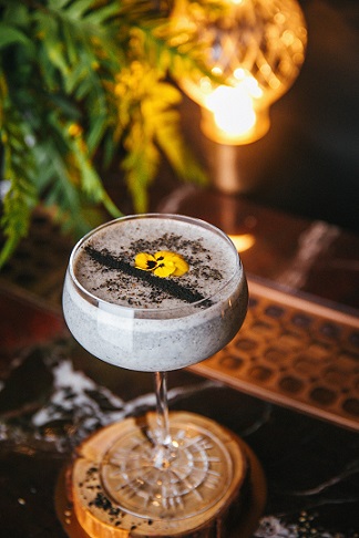 'Stone Slabs,' an East versus West cocktail that combines flavors of sesame and ginger with Tropical Island Rum and Mancino Bianco.
