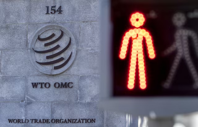 A logo is seen at the World Trade Organization (WTO) headquarters before a news conference in Geneva, Switzerland, October 5, 2022. REUTERS/Denis Balibouse/File Photo 