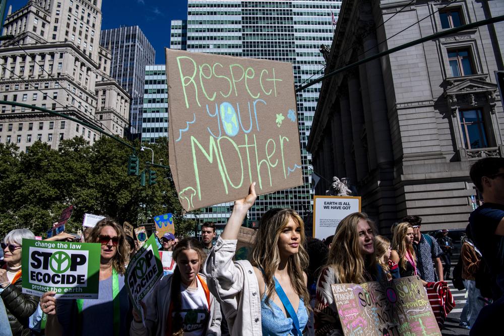 Activists walk through lower Manhattan for the Global Climate Strike protests, Sept. 23, 2022, in New York. The climate change generation is saying officials are talking too much, listening too little and acting even less. And they are fed up. (AP) Activists walk through lower Manhattan for the Global Climate Strike protests, Sept. 23, 2022, in New York. The climate change generation is saying officials are talking too much, listening too little and acting even less. And they are fed up. (AP)