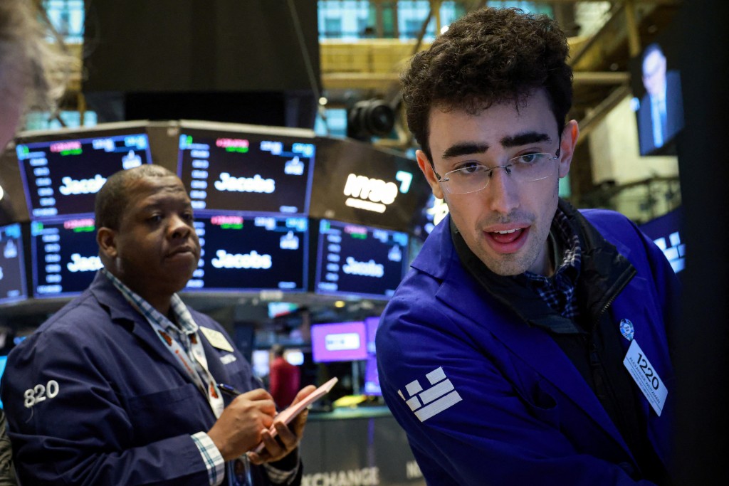 Traders work on the floor at the New York Stock Exchange (NYSE) in New York City, U.S., March 23, 2026.  REUTERS/Brendan McDermid