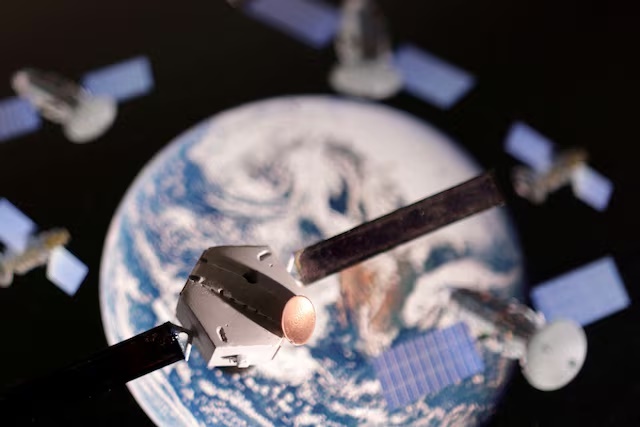 A satellite model is placed on a picture of Earth in this illustration taken November 25, 2024. REUTERS/Dado Ruvic/Illustration/File Photo A satellite model is placed on a picture of Earth in this illustration taken November 25, 2024. REUTERS/Dado Ruvic/Illustration/File Photo