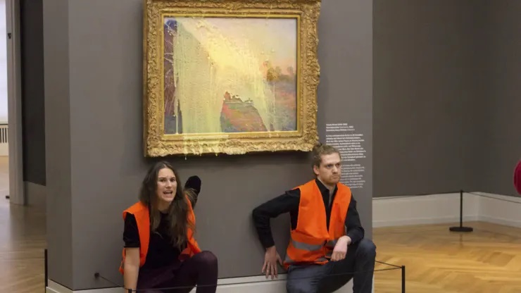 Climate protesters of Last Generation after throwing mashed potatoes at the Claude Monet painting “Les Meules” at Potsdam’s Barberini Museum on Sunday Oct. 24, 2022, to protest fossil fuel extraction. (File Photo) Climate protesters of Last Generation after throwing mashed potatoes at the Claude Monet painting “Les Meules” at Potsdam’s Barberini Museum on Sunday Oct. 24, 2022, to protest fossil fuel extraction. (File Photo)