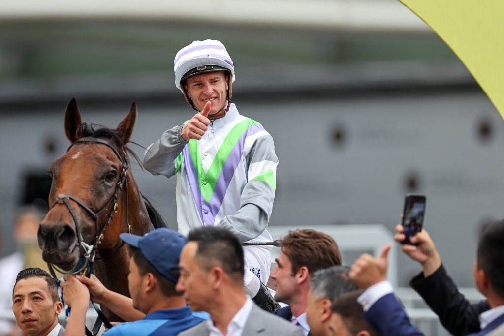 Zac Purton poses for a photo aboard Light Years Charm (HKJC)