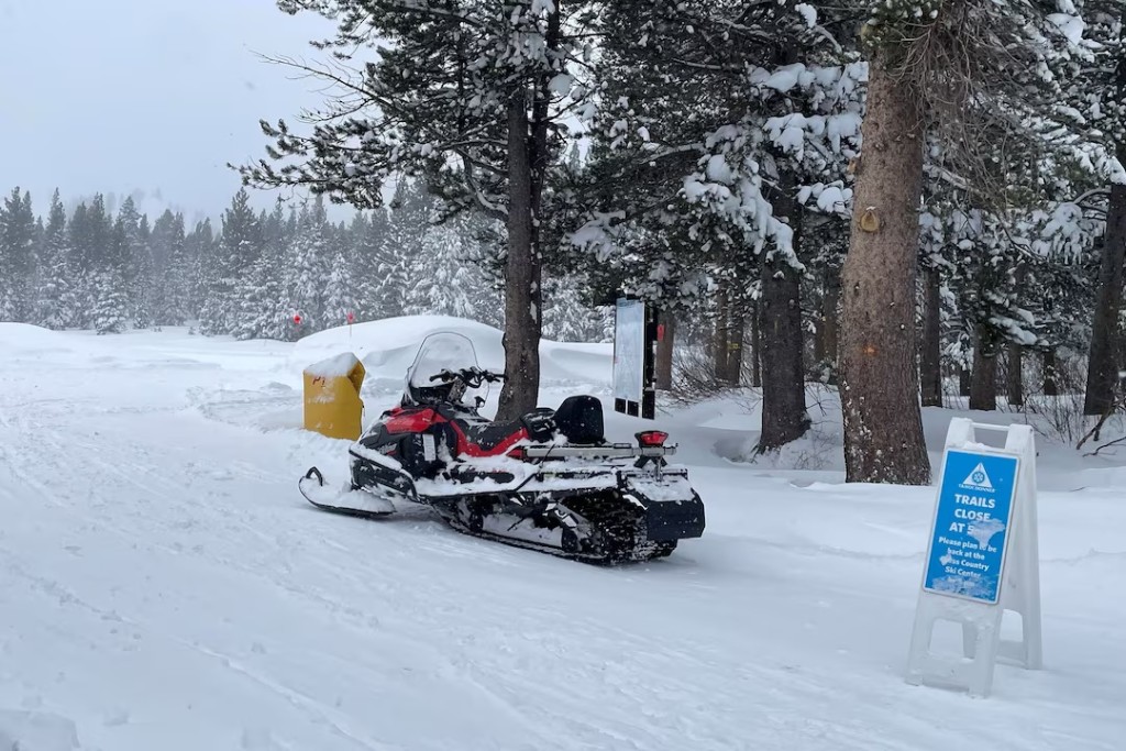 A snowmobile is parked at Alder Creek Adventure Center, one of two sites where search crews were launched to try to locate a group of missing skiers after an avalanche in a backcountry slope of California's Sierra Nevada mountains, in Truckee, California, U.S. February 18, 2026. REUTERS/Jenna Greene 