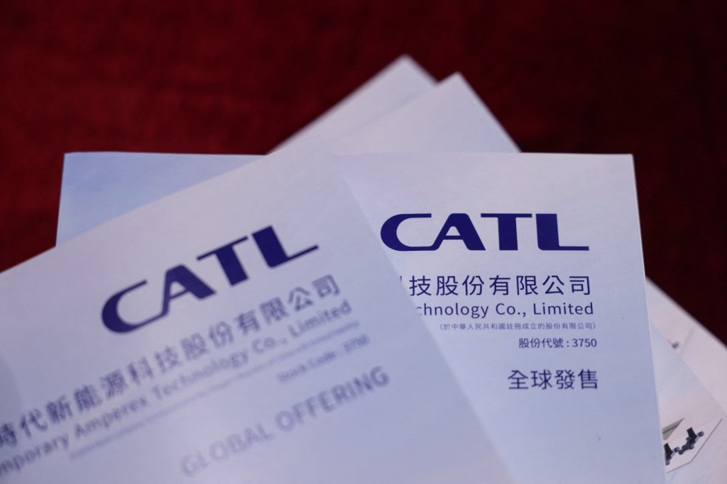 CATL prospectuses are seen during the company's listing ceremony at the Hong Kong Stock Exchange. Photo by REUTERS