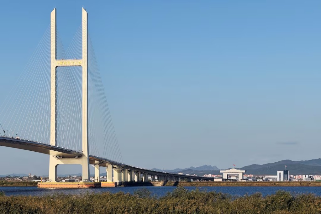 The New Yalu River Bridge designed to connect China's Dandong New Zone and North Korea's Sinuiju, as seen from Dandong, Liaoning province, China October 5, 2026. Picture taken with a mobile phone. REUTERS/Mandy Leong 