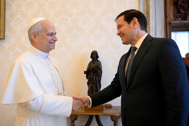 Pope Leo XIV shakes hands with U.S. Secretary of State Marco Rubio as they meet at the Vatican, May 19, 2025. Vatican Media/­Simone Risoluti/Handout via REUTERS /File Photo 