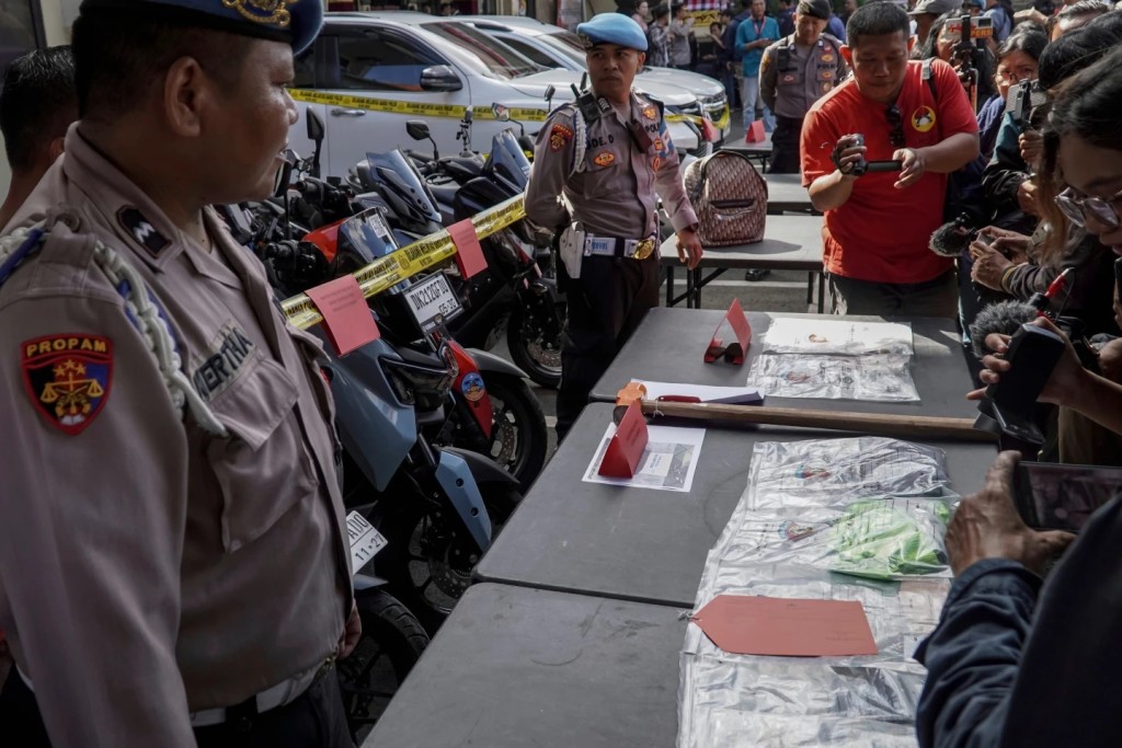 2 of 2 |  Police officers display evidence related to the fatal shooting of an Australian tourist during a press conference at the local police precinct in Badung, Bali, Indonesia, June 18, 2025. (AP Photo/Herdyanto)