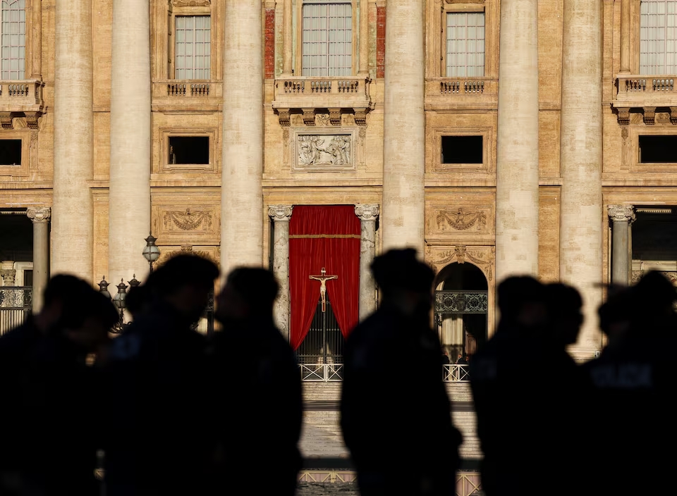 Police officers gather outside St. Peter's Basilica, following the death of Pope Francis, at the Vatican, April 22, 2025. (Reuters)