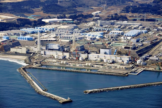 An aerial view shows the storage tanks for treated water at the tsunami-crippled Fukushima Daiichi nuclear power plant in Okuma town, Fukushima prefecture, Japan February 13, 2021, in this photo taken by Kyodo. Picture taken February 13, 2021. Kyodo/via REUTERS