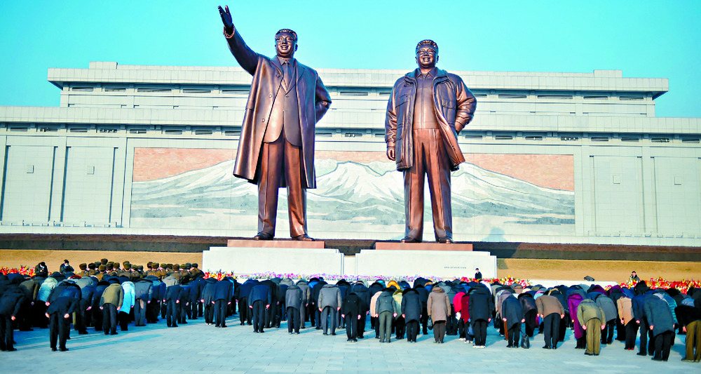 People visit the statues of late North Korean leaders Kim Il Sung and Kim Jong Il. AFP People visit the statues of late North Korean leaders Kim Il Sung and Kim Jong Il. AFP