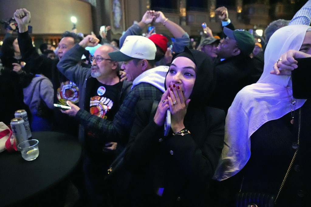 Supporters of New York City Mayoral candidate Zohran Mamdani celebrate during an election night event at the Brooklyn Paramount Theater in Brooklyn, New York on November 4, 2025. (Photo by Angelina Katsanis / AFP)