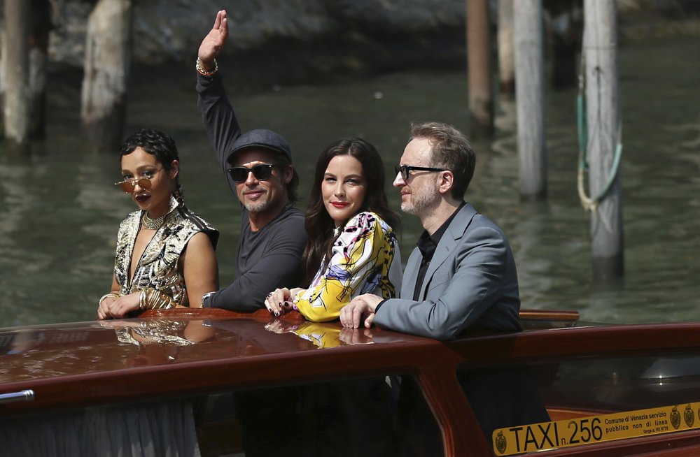 Actors Ruth Negga, from left, Brad Pitt, Liv Tyler and director James Gray arrive for the photo call of 'Ad Astra' at the Venice Film Festival. 