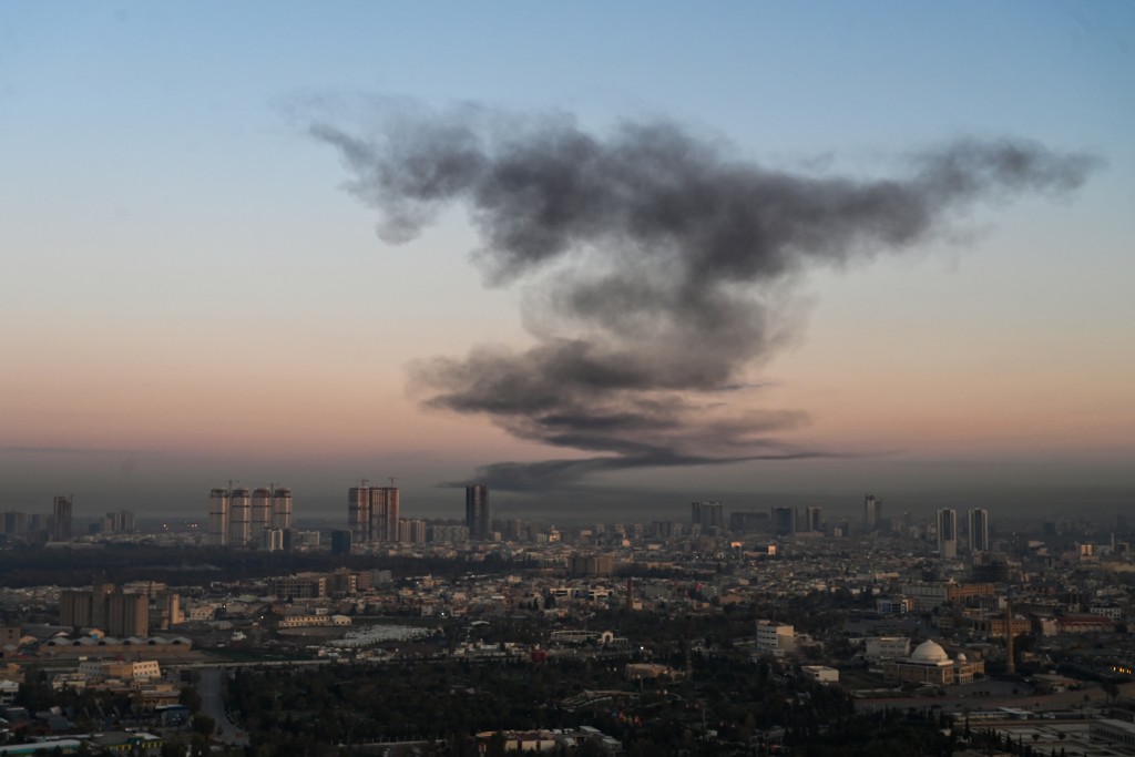 A plume of smoke rises near Erbil International Airport in Erbil on March 1, 2026. (AFP)