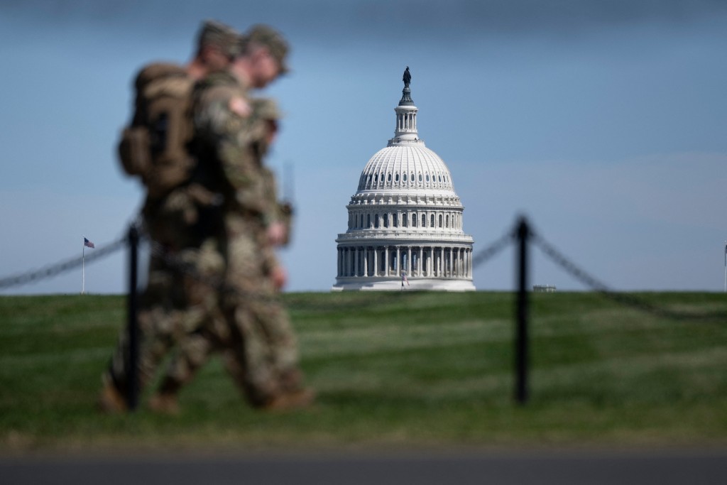 The US Capitol is seen as members of the National Guard patrol the National Mall in Washington, DC on September 8, 2025. Trump announced on August 25 new measures tightening his grip on security in Washington, ordering Defense Secretary Pete Hegseth to set up a specialized unit within Washington's National Guard for public order, and ending cashless bail. (Photo by Brendan Smialowski / AFP)