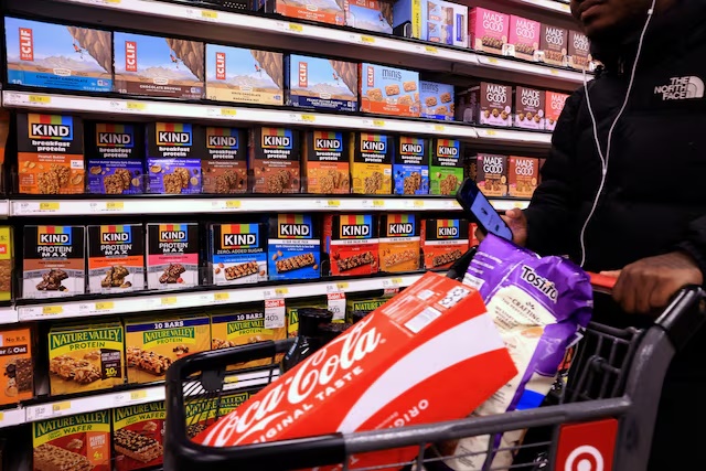 A shopper walks down an isle of Protein bars on a store shelf at a Target store in New York City, US, October 22, 2026. REUTERS/Brendan McDermid 