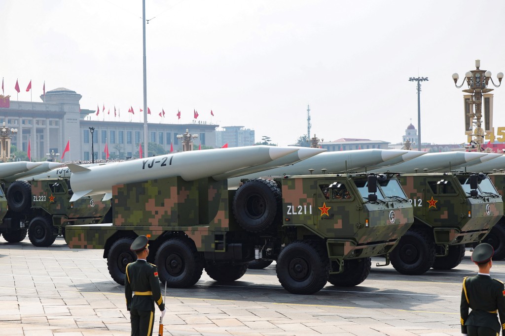 Members of the People's Liberation Army stand as YJ-21 missiles are displayed during a military parade to mark the 80th anniversary of the end of World War Two, in Beijing, China, September 3, 2025. (Reuters)