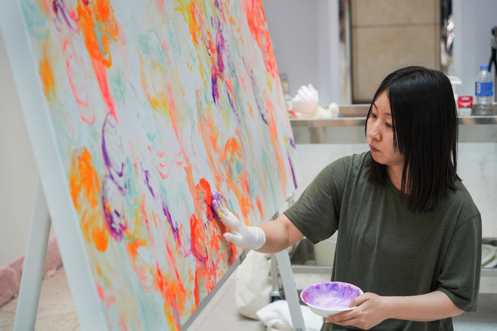 Ayako Rokkaku paints directly with her hands, allowing instinct to guide each movement as forms emerge naturally on the canvas.