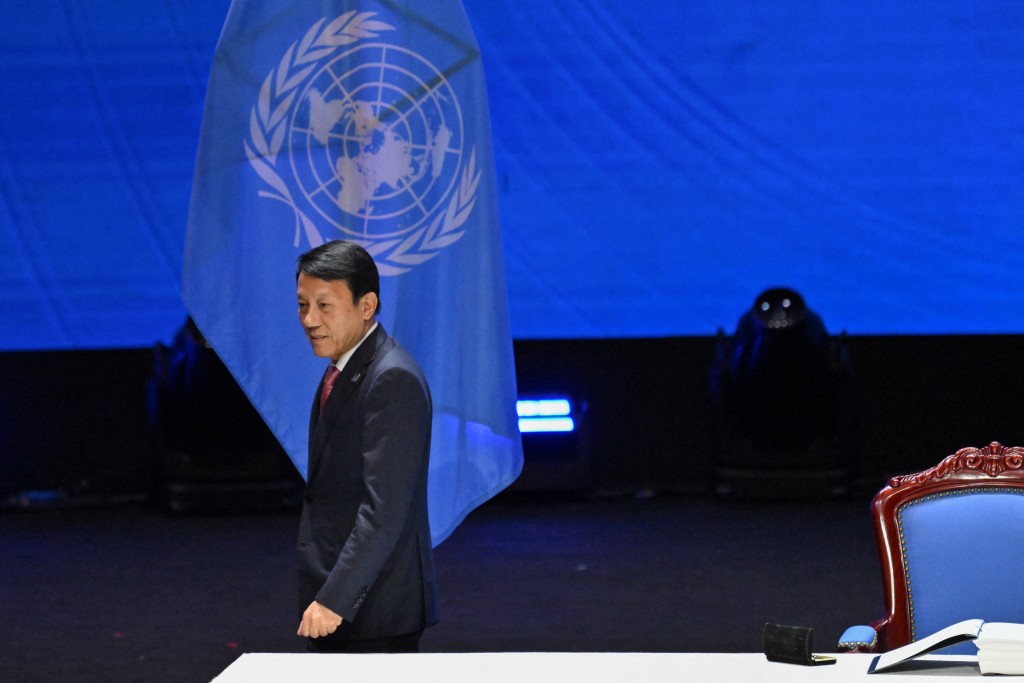 Vietnam's Minister of Public Security Luong Tam Quang leaves after inking his signature during the Signing Ceremony & High-Level Conference of the United Nations Convention Against Cybercrime at the National Convention Centre in Hanoi on October 25, 2025. (Photo by NHAC NGUYEN / AFP)