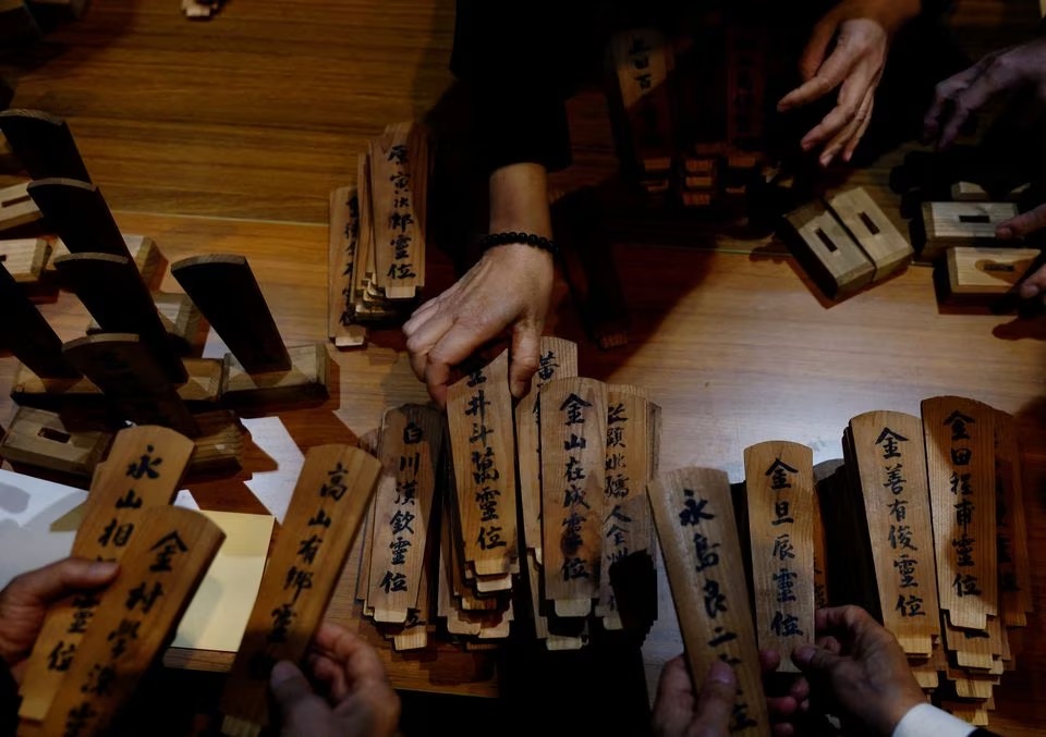 South Korean relatives of workers killed in a disaster at the Chosei coal mine, sort out ancestral tablets for the victims at a temple in Ube, Yamaguchi Prefecture, Japan. (Reuters) South Korean relatives of workers killed in a disaster at the Chosei coal mine, sort out ancestral tablets for the victims at a temple in Ube, Yamaguchi Prefecture, Japan. (Reuters)