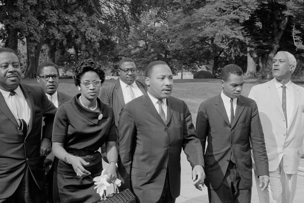 Martin Luther King Jr. (3rd R) is seen in an unknown location on August 5, 1965, a day before President Lyndon B. Johnson signed the Voting Rights Act into law. Library of Congress/Marion S. Trikosko/Handout via REUTERS