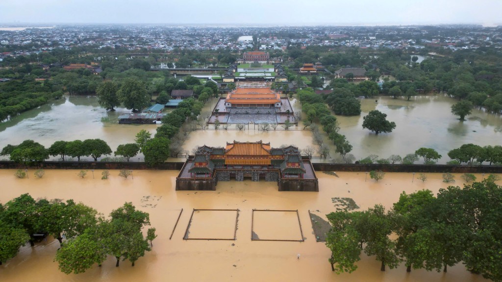 Photo by STR / AFP. An aerial view shows floodwaters inundating the Imperial City in Hue on October 28, 2025.