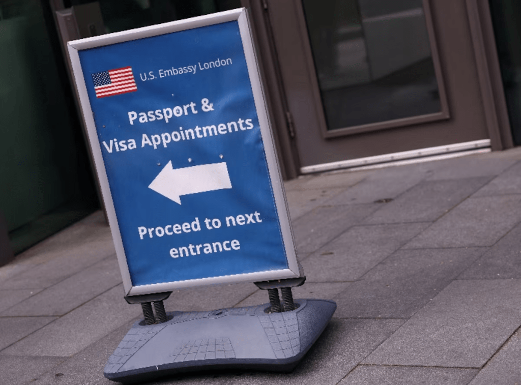An information sign for passport and visa appointments is displayed outside the U.S. embassy in London, Britain, May 29, 2025. REUTERS/Hannah McKay/File Photo