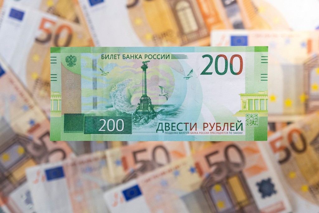 Russian rouble banknote is placed on Euro banknotes in this illustration taken April 7, 2022. REUTERS