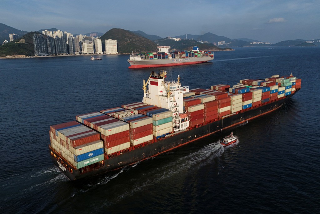 A drone view shows cargo ships sailing in Hong Kong, China, October 17, 2025. REUTERS/Tyrone Siu