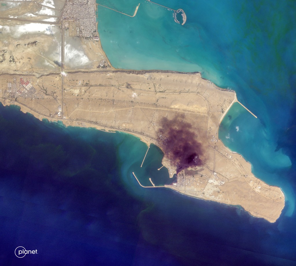 A smoke plume billowing from Konarak Naval Base in southern Iran along the Gulf of Oman. (AFP)