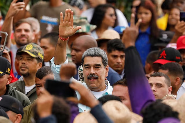 Venezuela's President Nicolas Maduro gestures, as he joins his supporters during a march to commemorate the Battle of Santa Ines, in Caracas, Venezuela, December 10, 2025. REUTERS/Leonardo Fernandez Viloria/File Photo