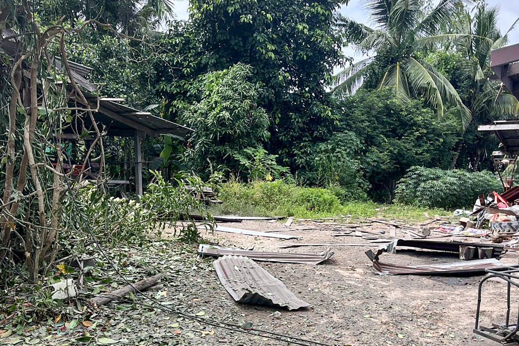 The debris of a damaged house by a rocket strike in Surin province's Kap Choeng district. (AFP)