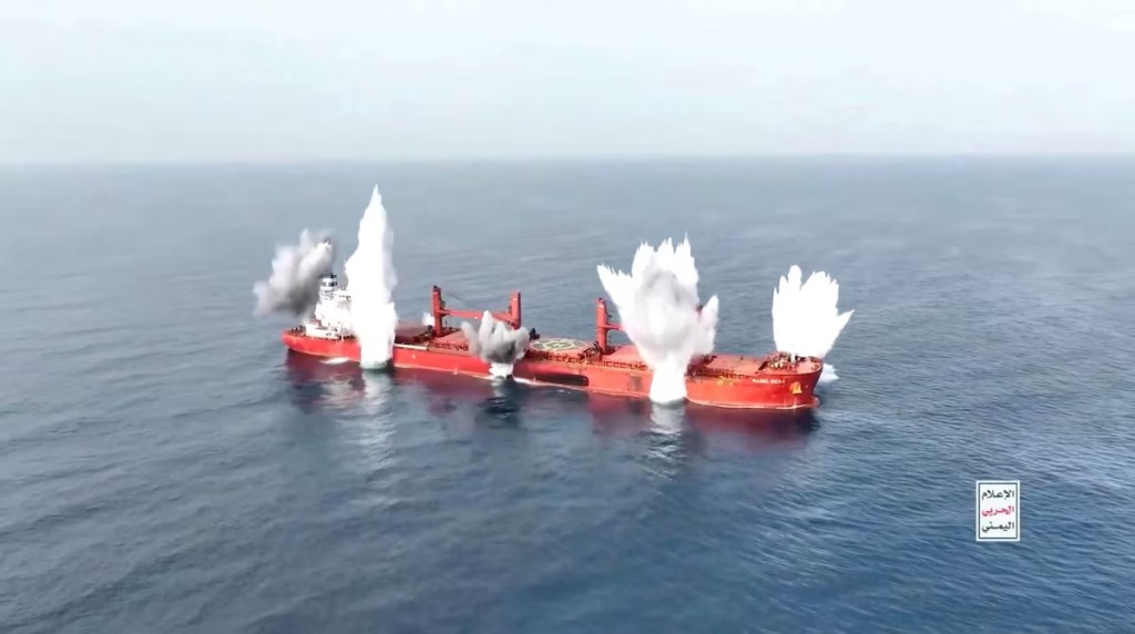 Plumes of smoke rise from what is said to be Liberia-flagged, Greek-operated bulk carrier, the MV Magic Seas that was, according to Yemen's Houthis, attacked following an alleged exchange with the captain, off southwest Yemen, in this screen grab taken from a handout video released on July 8, 2025. (HOUTHI MEDIA CENTER/Handout via REUTERS THIS IMAGE HAS BEEN SUPPLIED BY A THIRD PARTY. TEXT OVERLAY FROM SOURCE)
