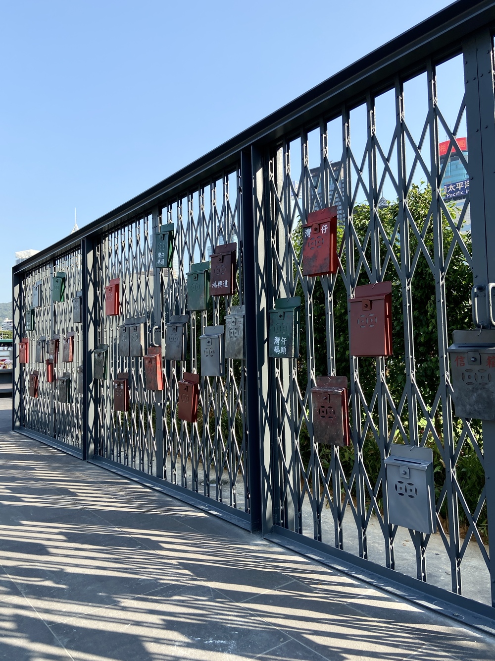 The Precinct is decorated with traditional, Hong Kong-style metal gates with brightly coloured mailboxes hanging on them.