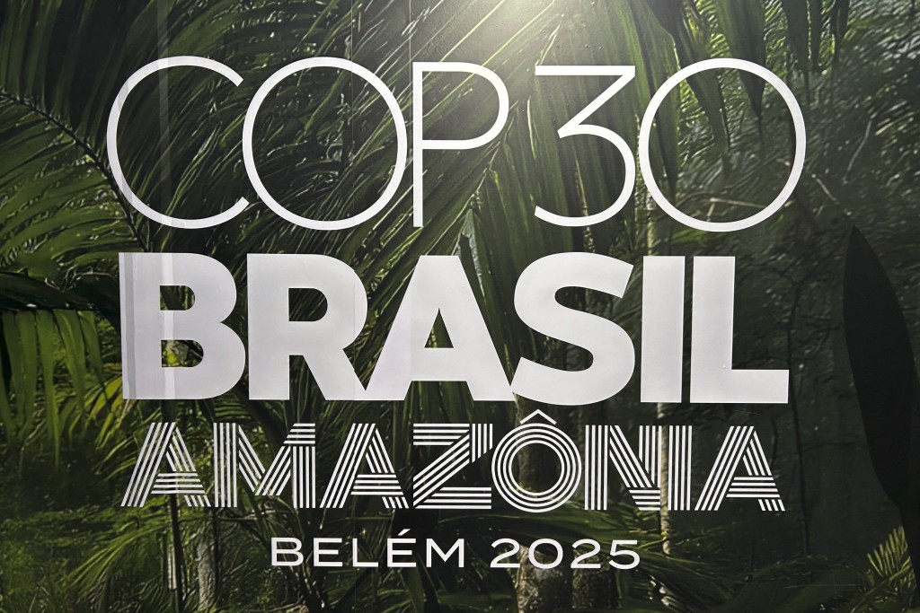 This view shows the COP30 logotype, at the Belem's airport in Para state, Brazil on October 25, 2025. (Photo by Thomas MORFIN / AFP)