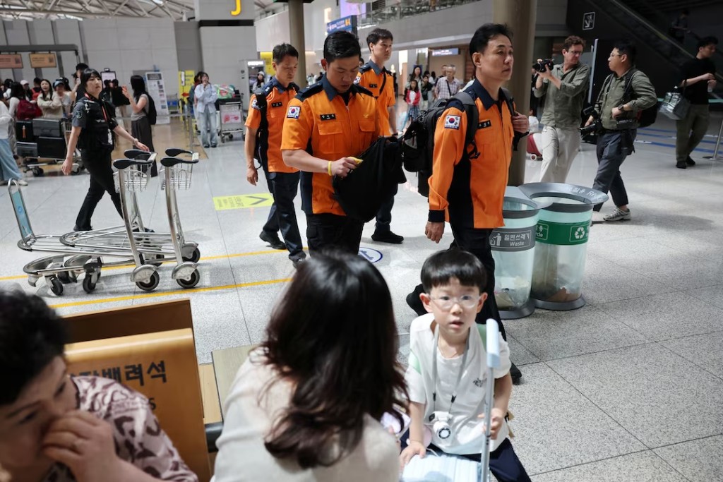 Members of a government response team that includes officials from the foreign ministry, police, and fire officials, leave for the flash-flood-hit area in Nepal, at Incheon International Airport in Incheon, South Korea, August 27, 2026. REUTERS/Kim Hong-Ji